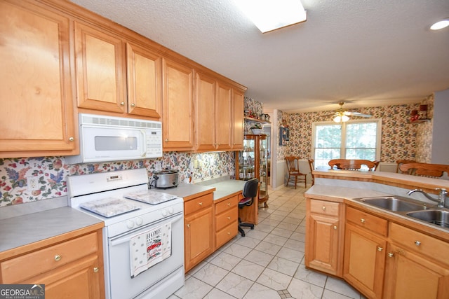 kitchen with white appliances, light tile patterned floors, a textured ceiling, ceiling fan, and sink