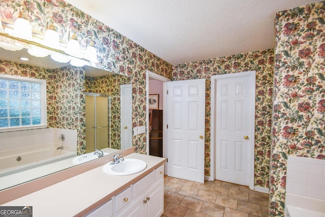 bathroom featuring tile patterned flooring, a textured ceiling, independent shower and bath, and vanity