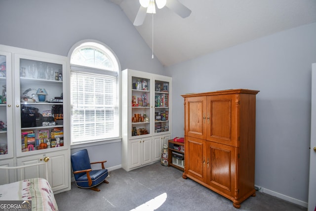 misc room featuring ceiling fan, light colored carpet, and vaulted ceiling