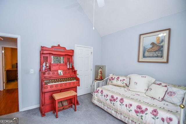 bedroom with carpet, ceiling fan, and high vaulted ceiling