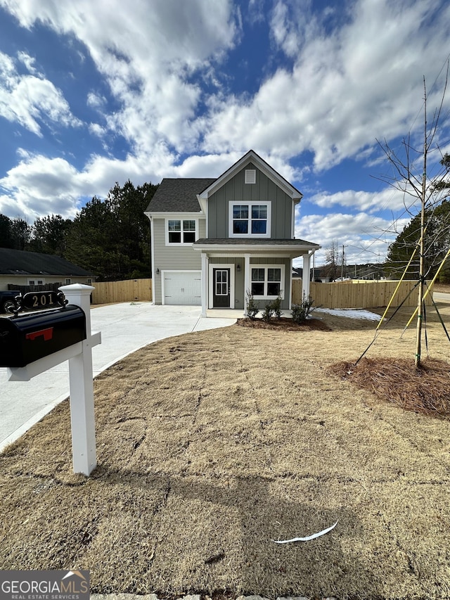 view of front of home with a garage and a porch