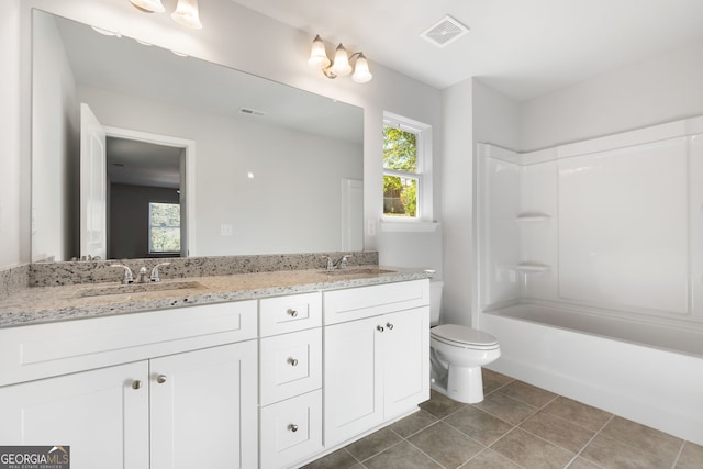 full bathroom featuring vanity, plenty of natural light, bathtub / shower combination, and toilet