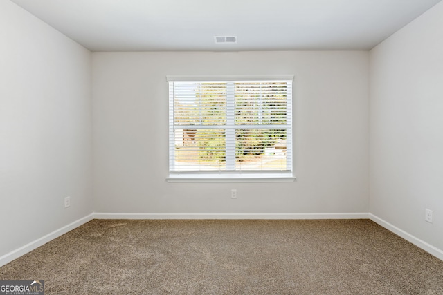 spare room with carpet flooring