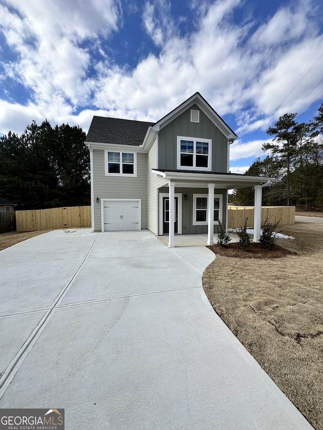 view of front of property with a garage and a porch