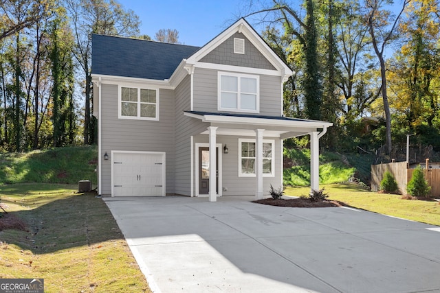 view of front facade with a garage and a front yard