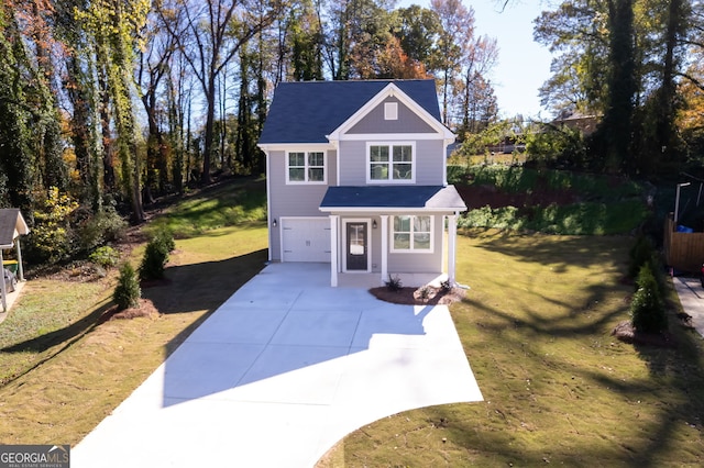 view of front property with a garage and a front yard