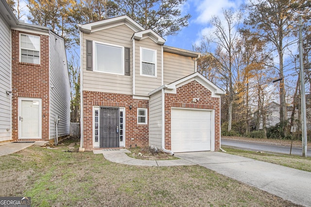 view of front of house featuring a garage and a front yard