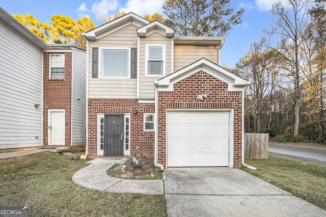5100 Windsor Forrest Ln, Atlanta, GA 30349 - traditional home with brick siding, concrete driveway, a garage, and a front yard