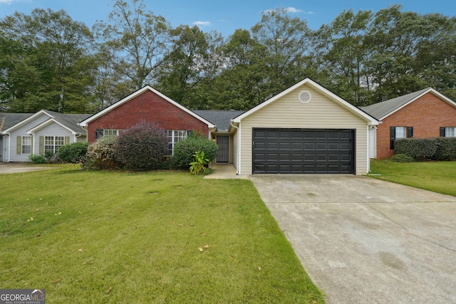 ranch-style house featuring a front yard and a garage