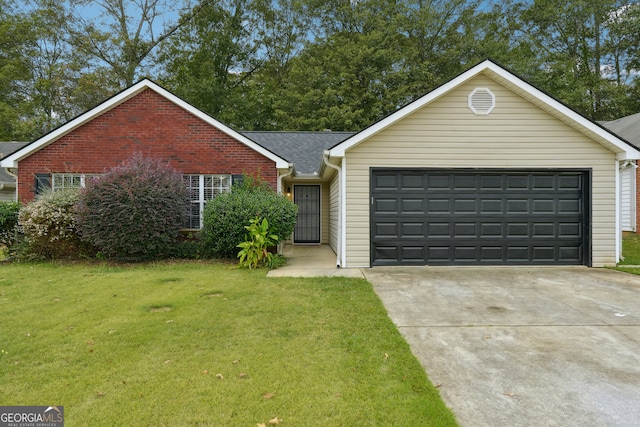 ranch-style home featuring a front lawn and a garage