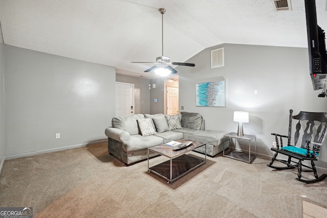 living room featuring vaulted ceiling, light carpet, and ceiling fan