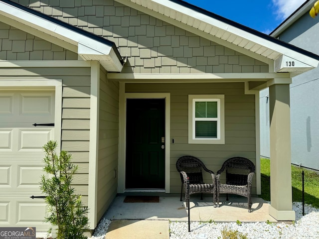 doorway to property featuring a garage