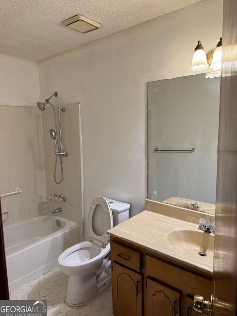 full bathroom featuring tile patterned flooring, a textured ceiling,  shower combination, vanity, and toilet