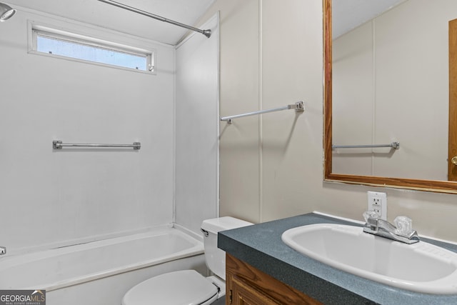 full bathroom with washtub / shower combination, vanity, and toilet