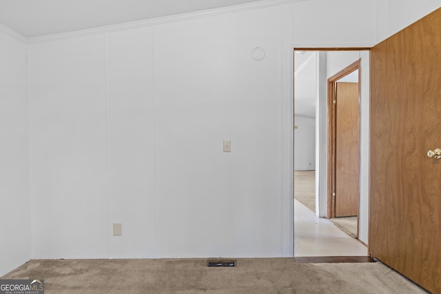 spare room featuring crown molding