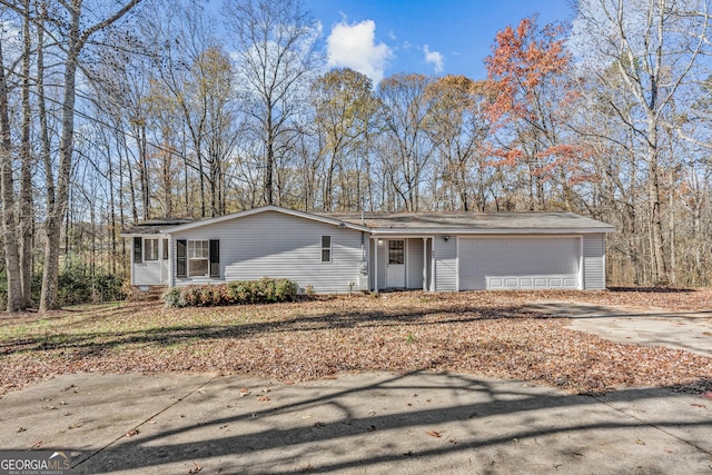 ranch-style house featuring a garage