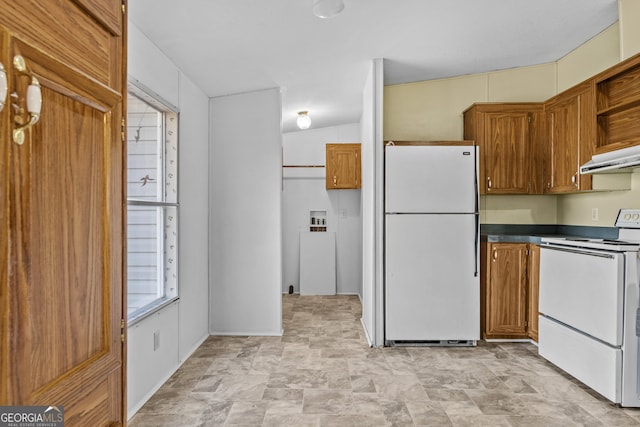 kitchen with lofted ceiling and white appliances