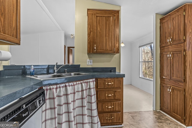 kitchen featuring dishwasher, lofted ceiling, sink, and light carpet