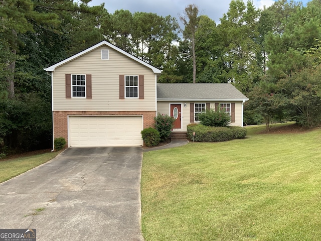 tri-level home featuring a garage and a front lawn