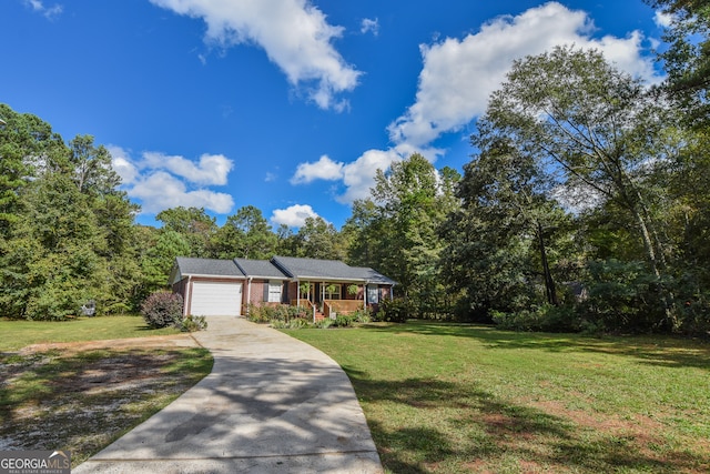 ranch-style home featuring a garage and a front lawn