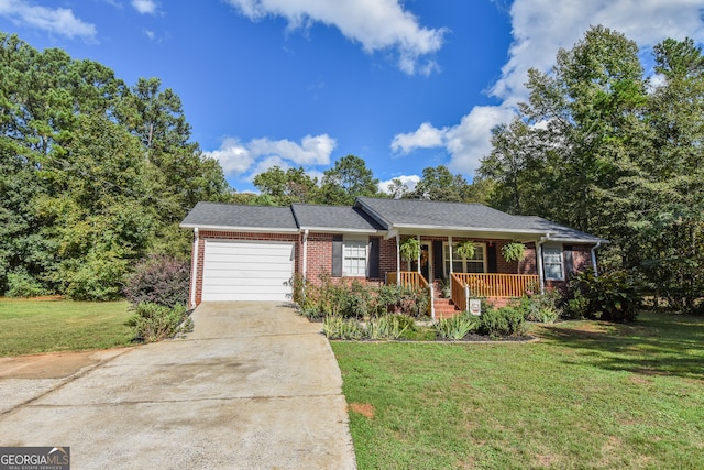 single story home featuring a front lawn, a porch, and a garage