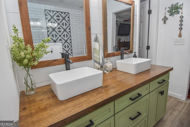 bathroom featuring hardwood / wood-style flooring and vanity