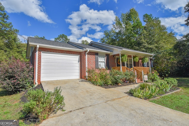 single story home with a garage and a porch