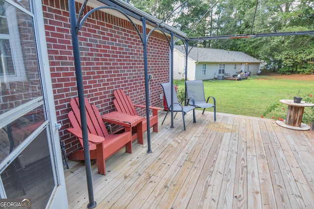 wooden deck with a lawn