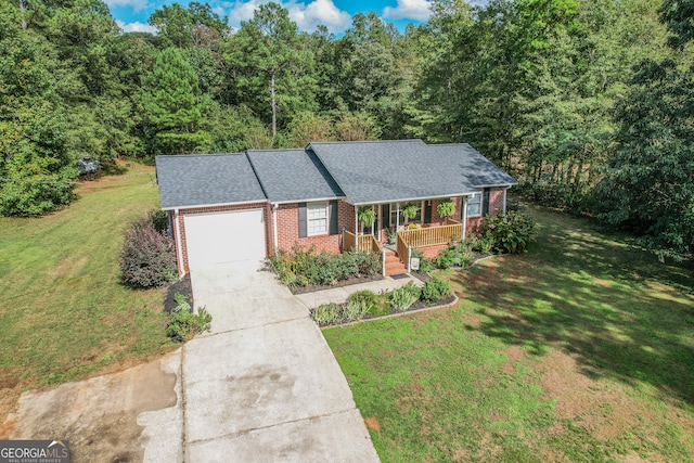 ranch-style house with a front lawn, covered porch, and a garage