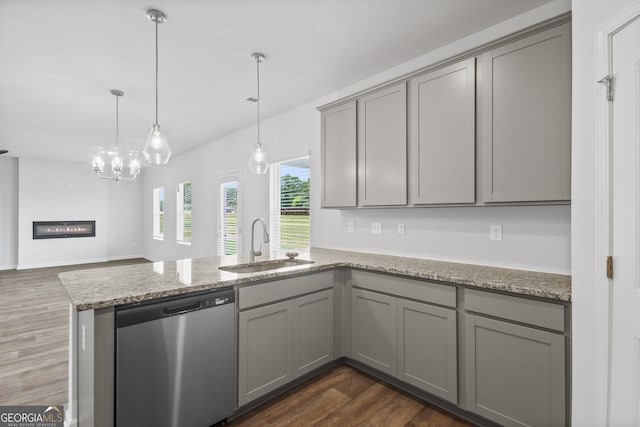 kitchen featuring gray cabinets, sink, dark hardwood / wood-style flooring, and stainless steel dishwasher