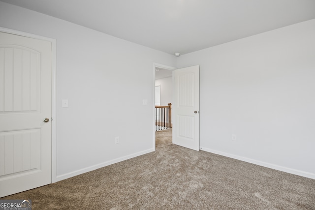 unfurnished bedroom featuring carpet flooring