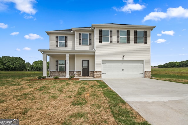 view of front facade featuring a garage, covered porch, and a front lawn