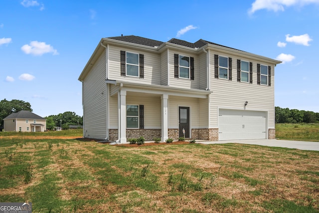 view of front of home featuring a porch, a garage, and a front lawn