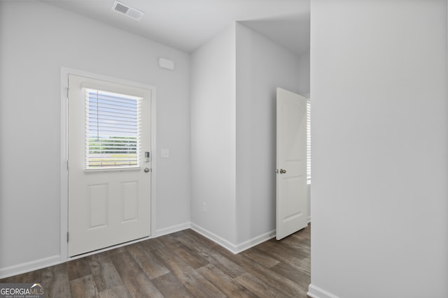 doorway to outside with dark wood-type flooring