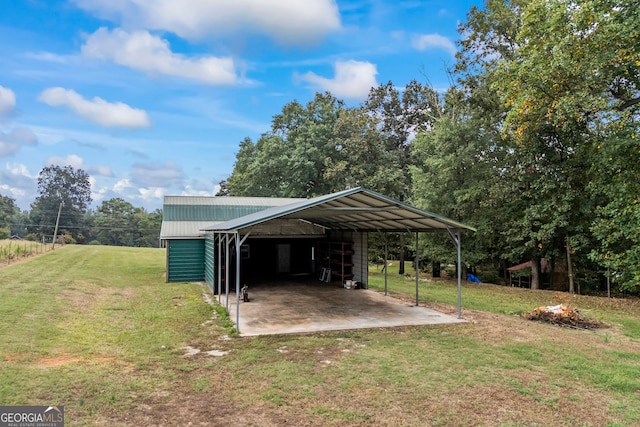 view of outdoor structure with a lawn and a carport