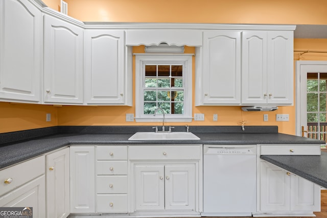 kitchen with sink, white dishwasher, and white cabinets