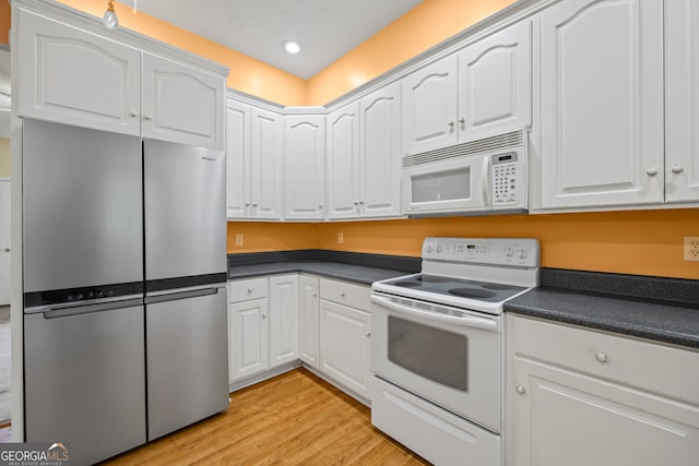 kitchen featuring light hardwood / wood-style floors, white appliances, and white cabinets