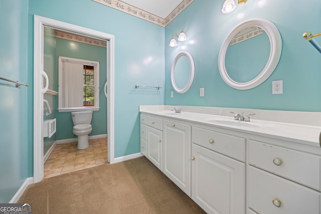 bathroom with vanity and toilet