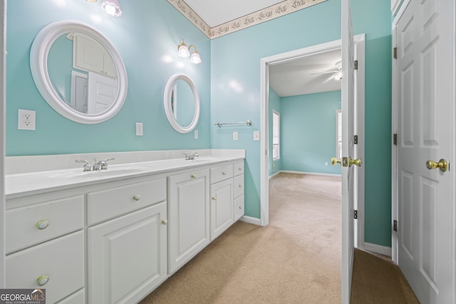 bathroom with ceiling fan and vanity