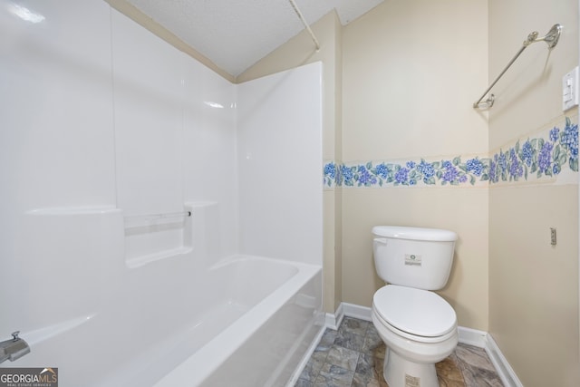 bathroom featuring shower / washtub combination, a textured ceiling, and toilet