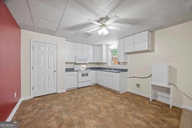 kitchen featuring ceiling fan, carpet flooring, sink, and white appliances