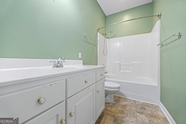 full bathroom with bathtub / shower combination, vanity, and toilet