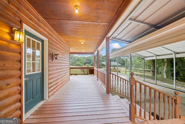 wooden terrace featuring covered porch