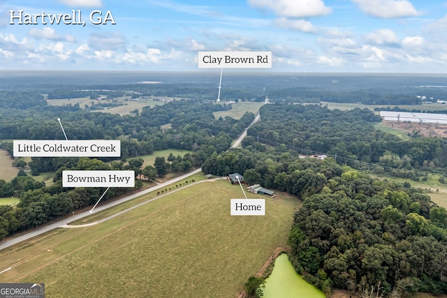 birds eye view of property featuring a rural view