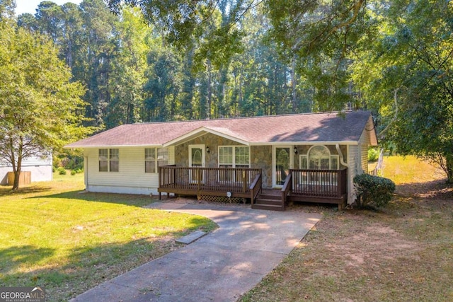 single story home with a front yard and covered porch