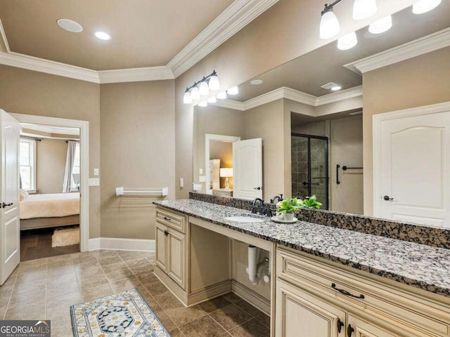 bathroom with vanity, crown molding, and an enclosed shower