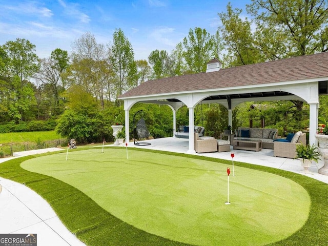 view of property's community featuring outdoor lounge area, a gazebo, and a patio area