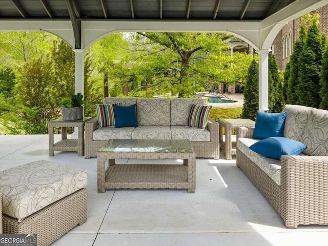 view of patio featuring a gazebo and an outdoor hangout area