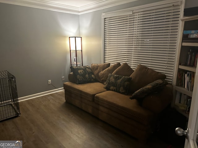 living room with crown molding and dark wood-type flooring