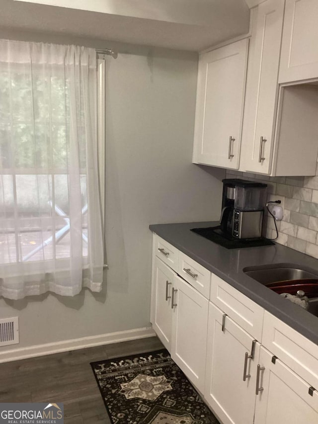 2734 Laurel View Dr, Snellville, GA 30039 - kitchen with visible vents, white cabinets, and dark countertops